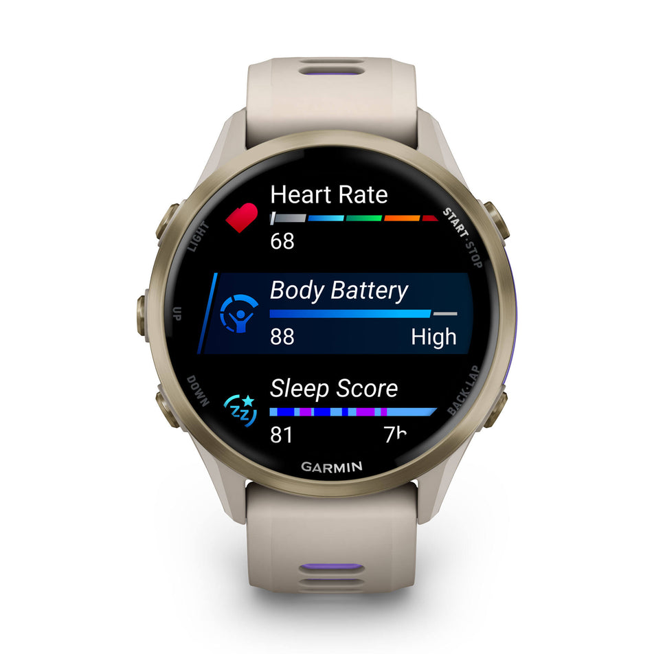 A Garmin Forerunner 970. Soft Gold Titanium with French Grey Case and French Grey/Translucent Indigo Band. Metrics/stats screen. (8692403962018)