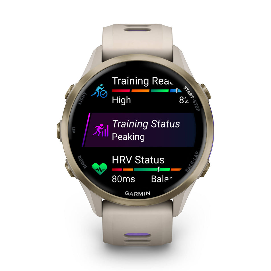 A Garmin Forerunner 970. Soft Gold Titanium with French Grey Case and French Grey/Translucent Indigo Band. Metrics/stats screen. (8692403962018)