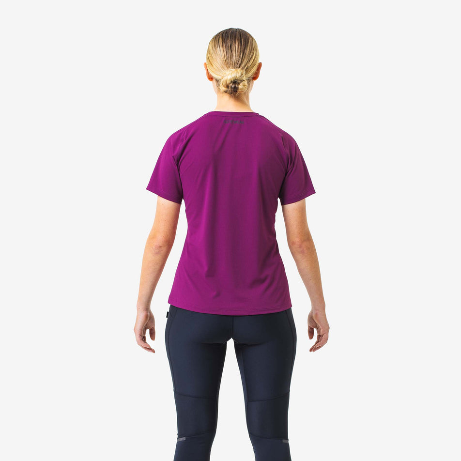 Back view of a model wearing a GOREWEAR Women's Everyday Solid Tee in the Process Purple colourway. Model is also wearing leggings.  (8166513442978)