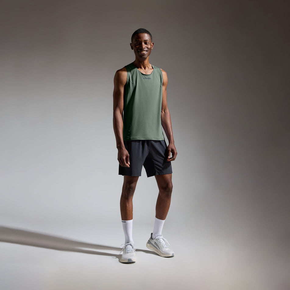 Front view of a model wearing the GOREWEAR Men's Contest 2.0 Singlet in the Slate Green colourway.