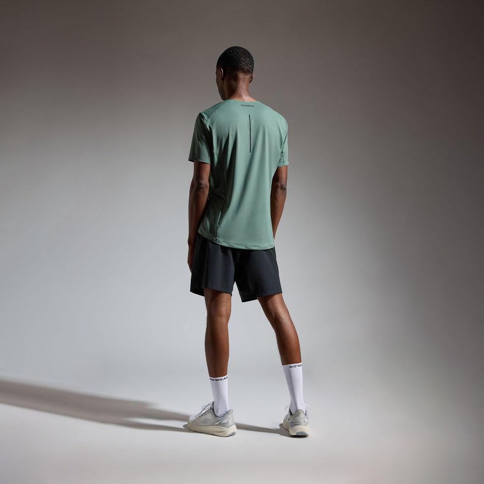 Back view of a model wearing the GOREWEAR Men's Contest 2.0 Tee in the Slate Green colourway.