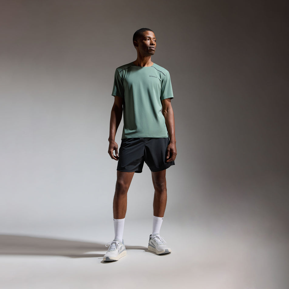 Front view of a model wearing the GOREWEAR Men's Contest 2.0 Tee in the Slate Green colourway.