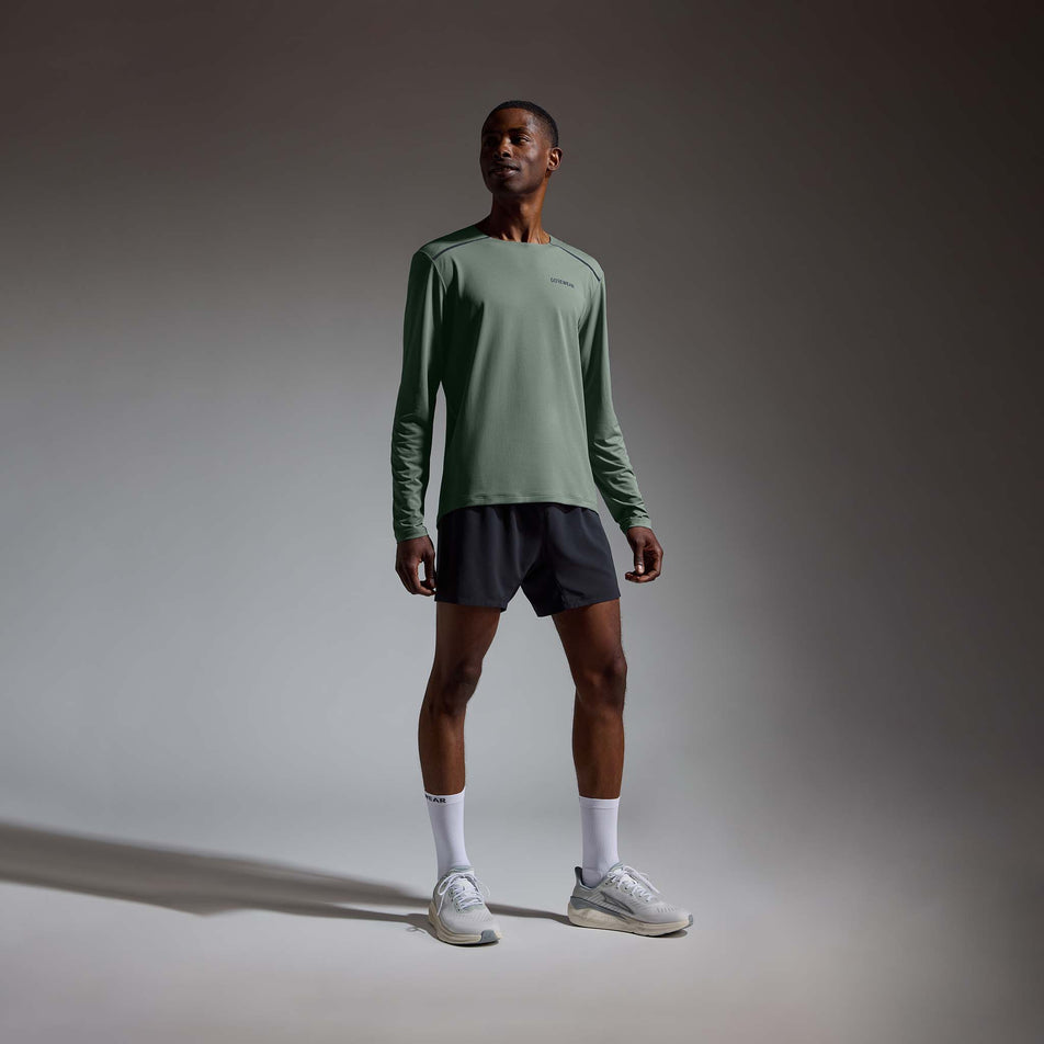 Front view of a model wearing the GOREWEAR Men's Contest 2.0 Long Sleeve Tee in the Slate Green colourway.