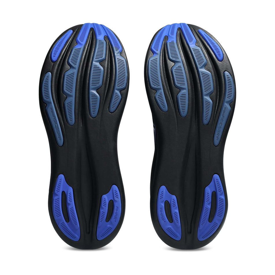 The outsoles of a pair of ASICS Men's Gel-Nimbus 28 Running Shoes in the Black/Neon Blue colourway.