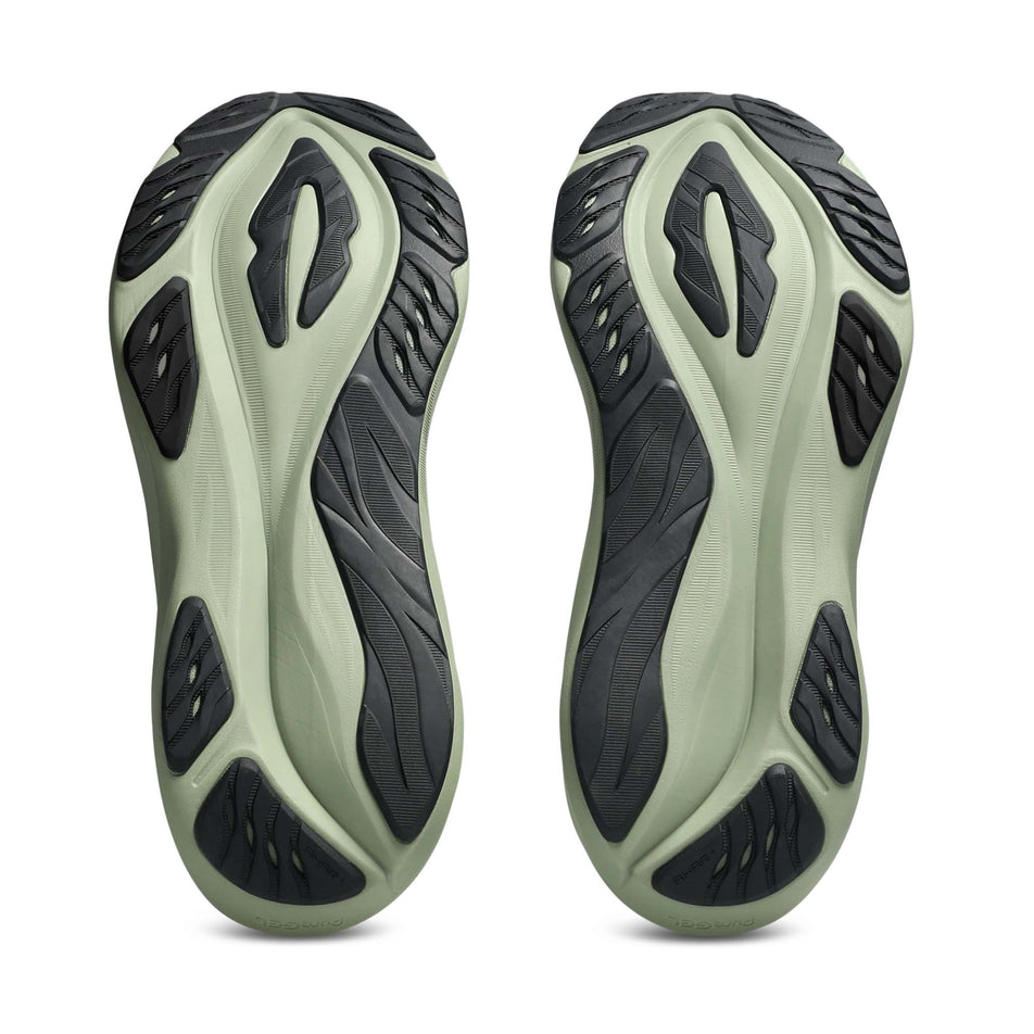 The outsoles of a pair of ASICS Men's GT-2000 15 Running Shoes in the Birch/Khaki Green colourway.