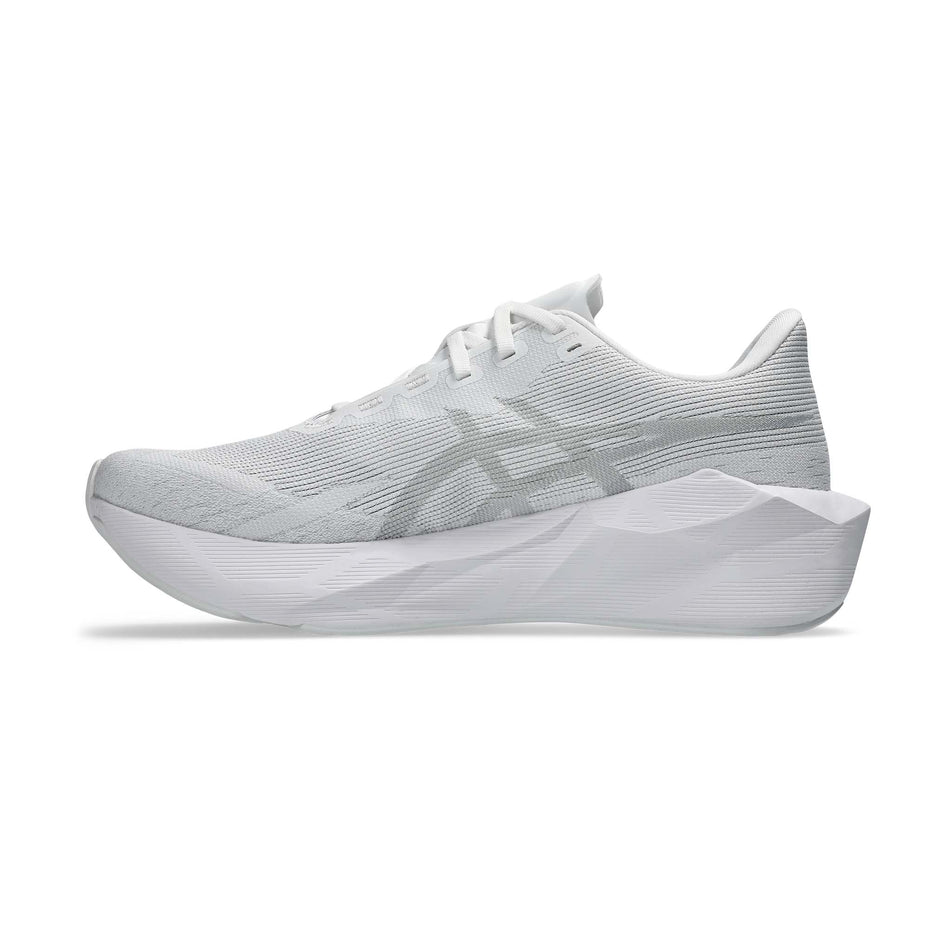 Medial view of the right shoe from a pair of ASICS Men's Novablast 6 Running Shoes in the White/White colourway.
