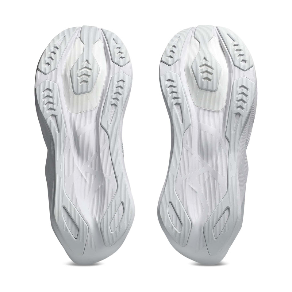 The outsoles of a pair of ASICS Men's Novablast 6 Running Shoes in the White/White colourway.