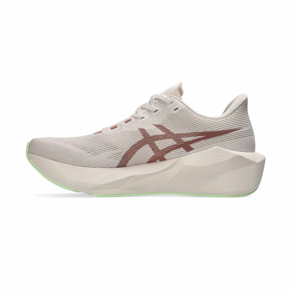Medial view of the right shoe from a pair of ASICS Men's Novablast 6 Running Shoes in the Rose Dust/Illuminate Yellow colourway.