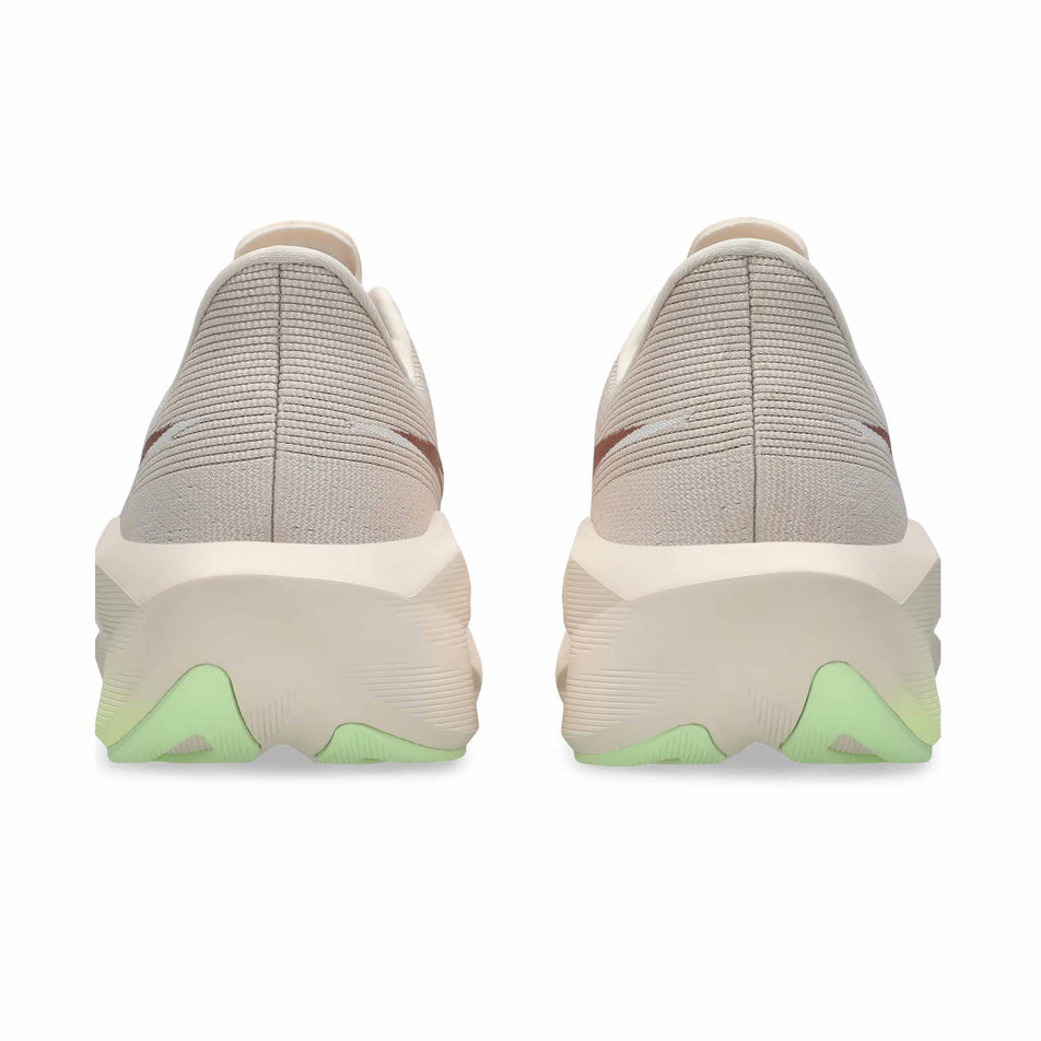 The back of a pair of ASICS Men's Novablast 6 Running Shoes in the Rose Dust/Illuminate Yellow colourway.