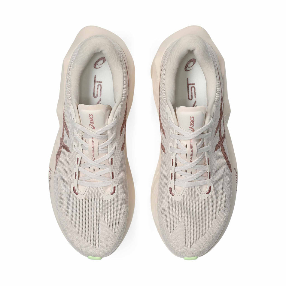 The uppers of a pair of ASICS Men's Novablast 6 Running Shoes in the Rose Dust/Illuminate Yellow colourway.