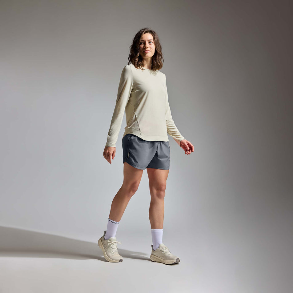 Angled view of a model wearing the GOREWEAR  Women's Training Shorts in the Lab Graphite colourway.