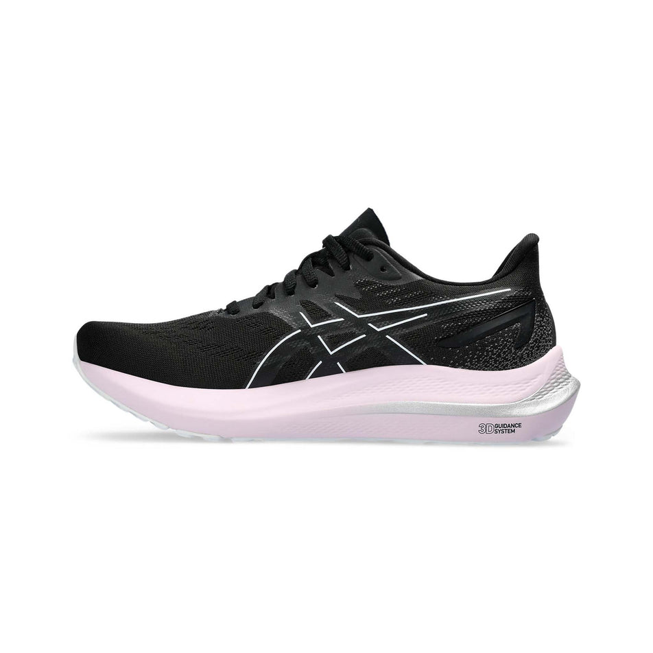 Medial side of the right shoe from a pair of Asics Women's GT-2000 12 Running Shoes in the Black/White colourway (8132718035106)