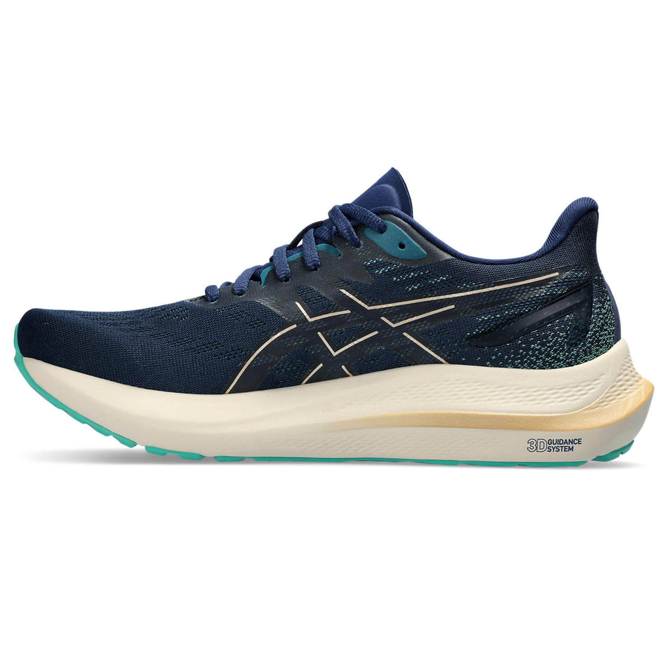 Medial side of the right shoe from a pair of Asics Women's GT-2000 12 Running Shoes in the Blue Expanse/Champagne colourway (8232994242722)