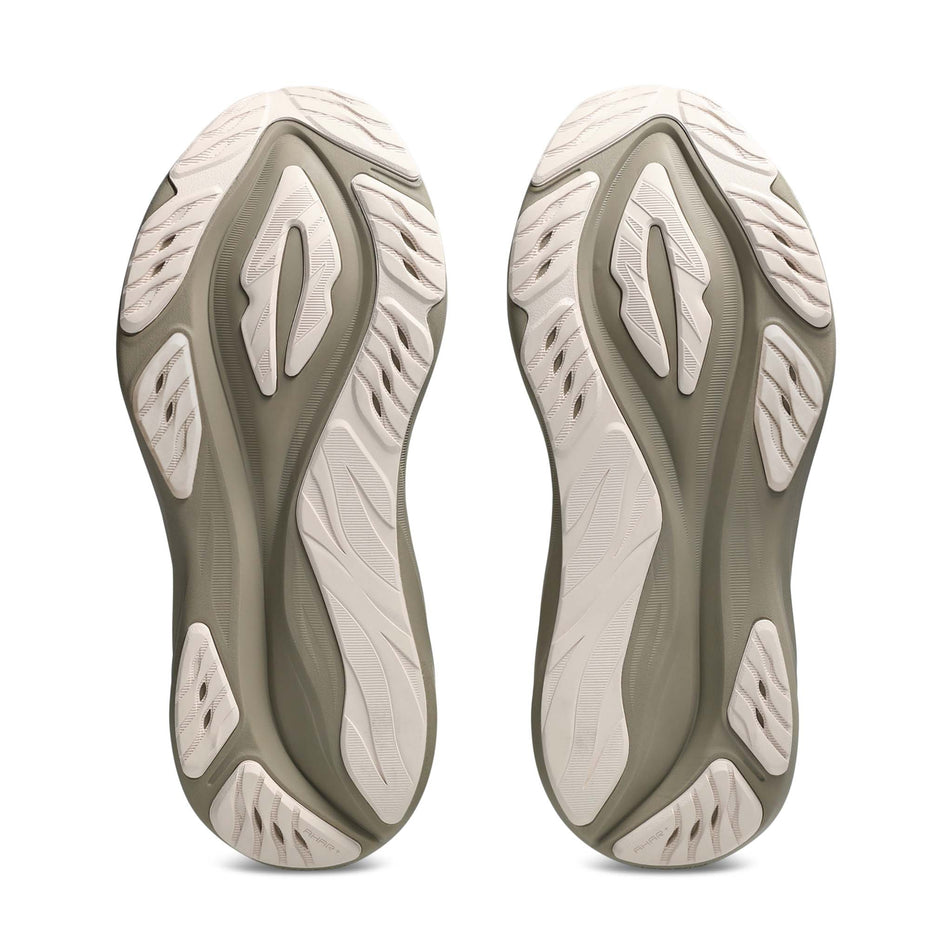 The outsoles of a pair of ASICS Women's GT-2000 15 Running Shoes in the Birch/Greige colourway.