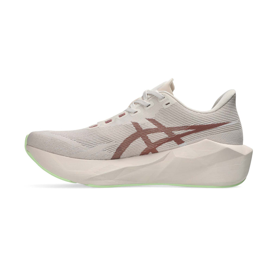 Medial view of the right shoe from a pair of ASICS Women's Novablast 6 Running Shoes in the Rose Dust/Illuminate Yellow colourway.