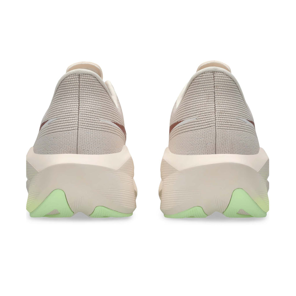 The back of a pair of ASICS Women's Novablast 6 Running Shoes in the Rose Dust/Illuminate Yellow colourway.