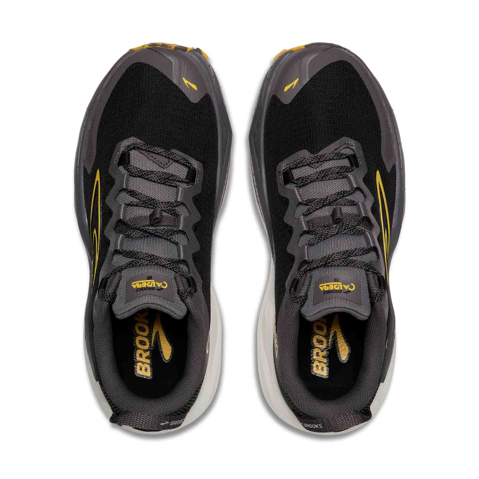 The uppers of a pair of Brooks Men's Caldera 8 Running Shoes in the Black/Rabbit/Zest colourway.