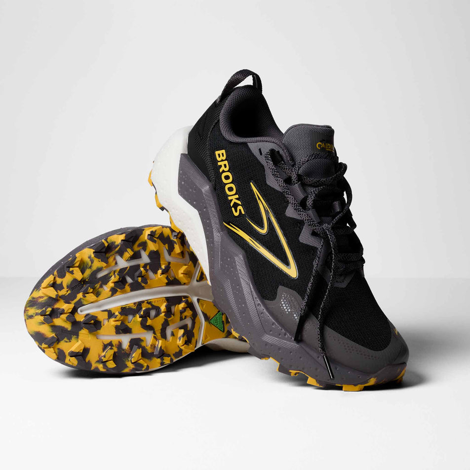 A pair of Brooks Men's Caldera 8 Running Shoes in the Black/Rabbit/Zest colourway.