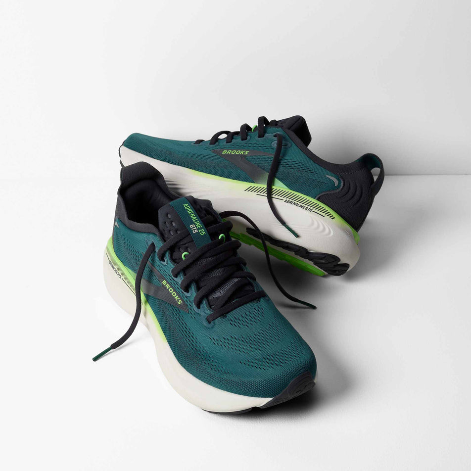 A pair of Brooks Men's Adrenaline GTS 25 Running Shoes in the Atlantic Deep/Coconut/Green colourway.