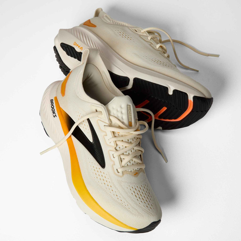A pair of Brooks Men's Glycerin 23 Running Shoes in the Arctic Wolf/Angora/Orange colourway.