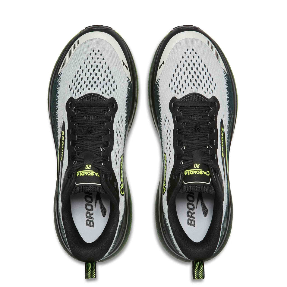 The uppers of a pair of Brooks Men's Cascadia 20 Running Shoes in the Grey/Black/Nightlife colourway.