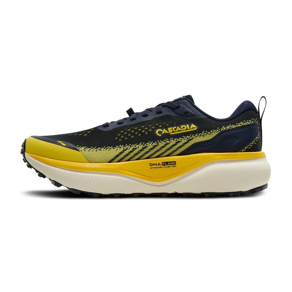 Medial view of the right shoe from a pair of Brooks Men's Cascadia 20 Running Shoes in the Navy/Cyber Yellow/Grey colourway.