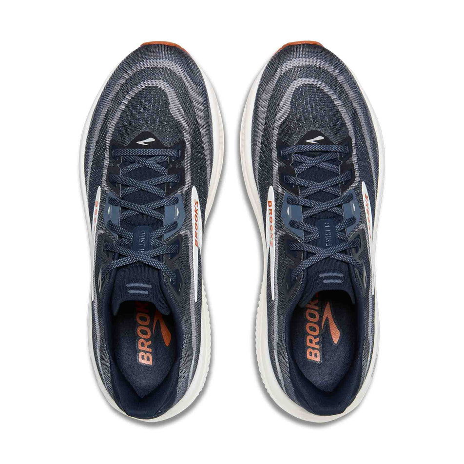 The uppers of a pair of Brooks Men's Ghost 18 Running Shoes in the Navy Blazer/Red Earth/Blue colourway.