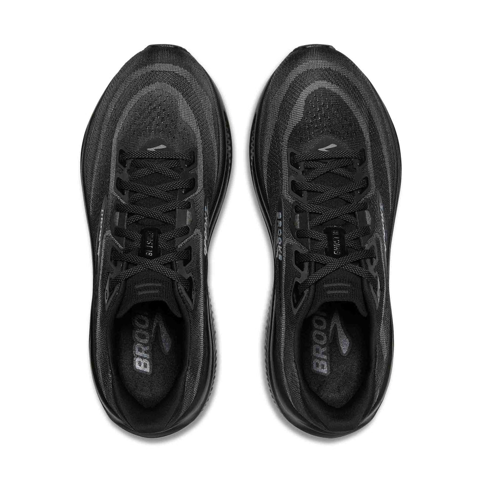 The uppers of a pair of Brooks Men's Ghost 18 2E Running Shoes in the Black/Black/Ebony colourway.