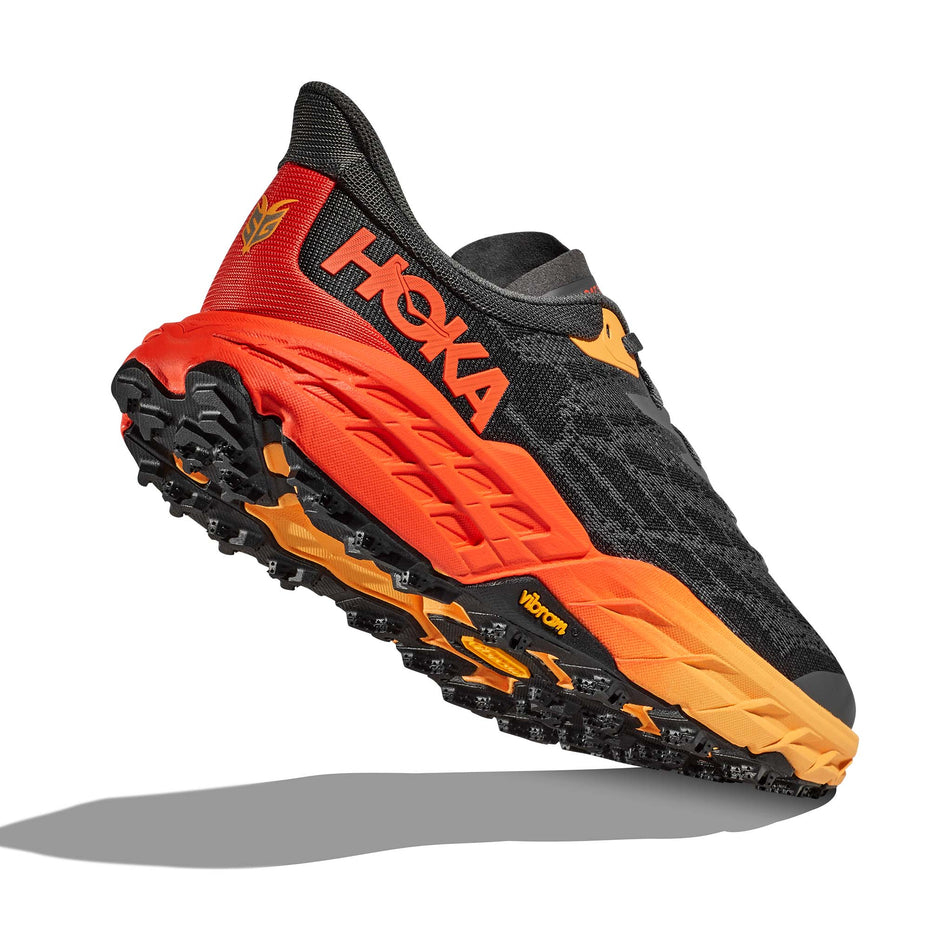 A view of the majority of the outsole on the right shoe from a pair of Hoka Men's Speedgoat 5 Running Shoes in the Castlerock/Flame colourway (7922042994850)