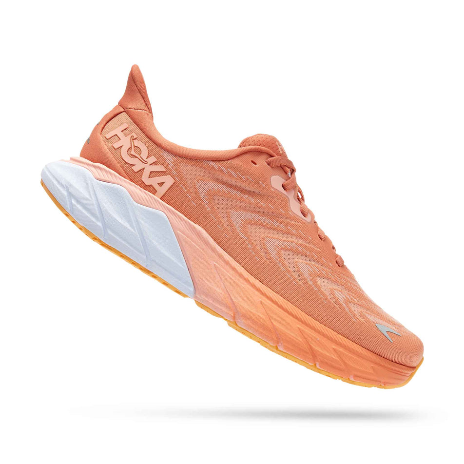 Lateral side of the right shoe from a pair of HOKA Women's Arahi 6 Running Shoes in the Sun Baked/Shell Coral colourway (8044976701602)