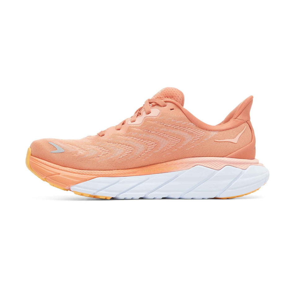 Medial side of the right shoe from a pair of HOKA Women's Arahi 6 Running Shoes in the Sun Baked/Shell Coral colourway (8044976701602)