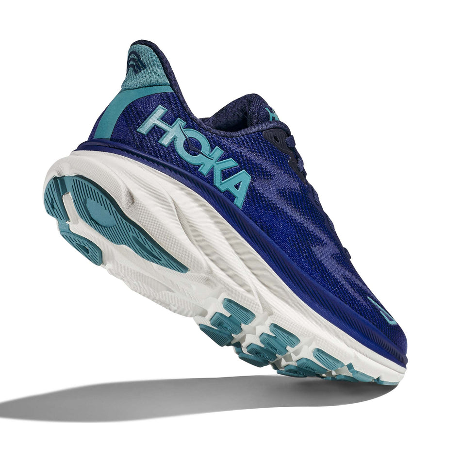 A view of the majority of the outsole on the right shoe from a pair of Hoka Women's Clifton 9 Running Shoes in the Bellweather Blue/Evening Sky colourway (7922048434338)