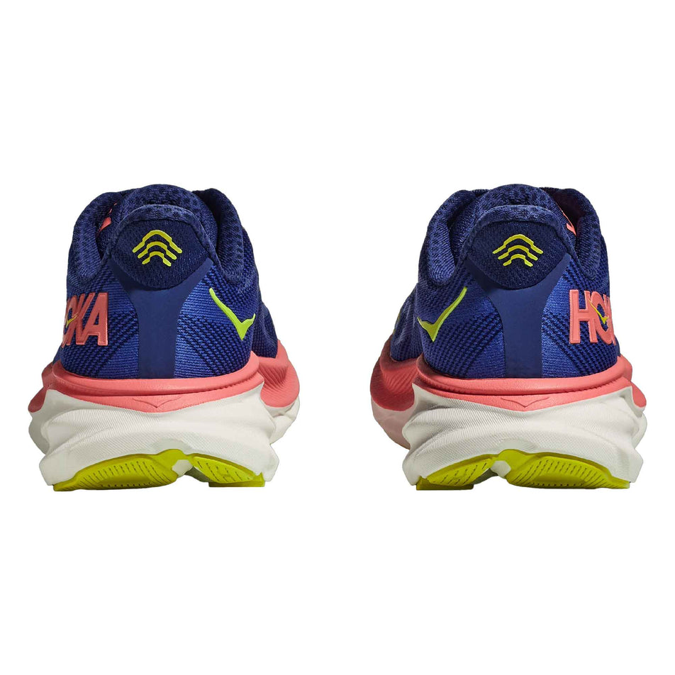 The back of a pair of HOKA Women's Clifton 9 Running Shoes in the Evening Sky/Coral colourway (8144922411170)