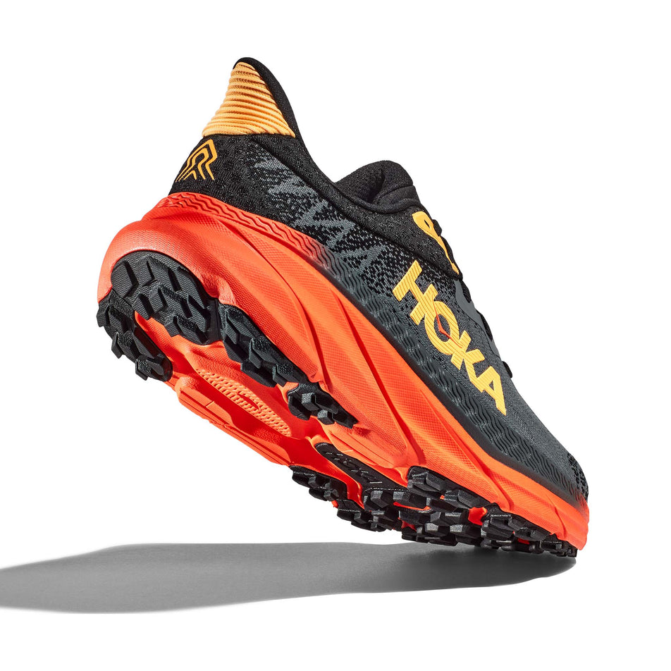 A view of the majority of the outsole on the right shoe from a pair of Hoka Men's Challenger ATR 7 Running Shoes in the Castlerock/Flame colourway (7922041159842)
