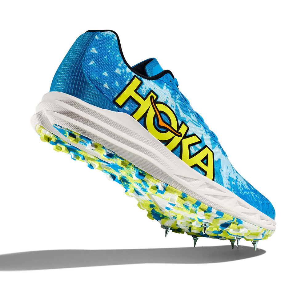 A view of the majority of the outsole on the right shoe from a pair of Hoka Unisex Crescendo XC Spikes in the Diva Blue/Evening Primrose colourway (7922066096290)