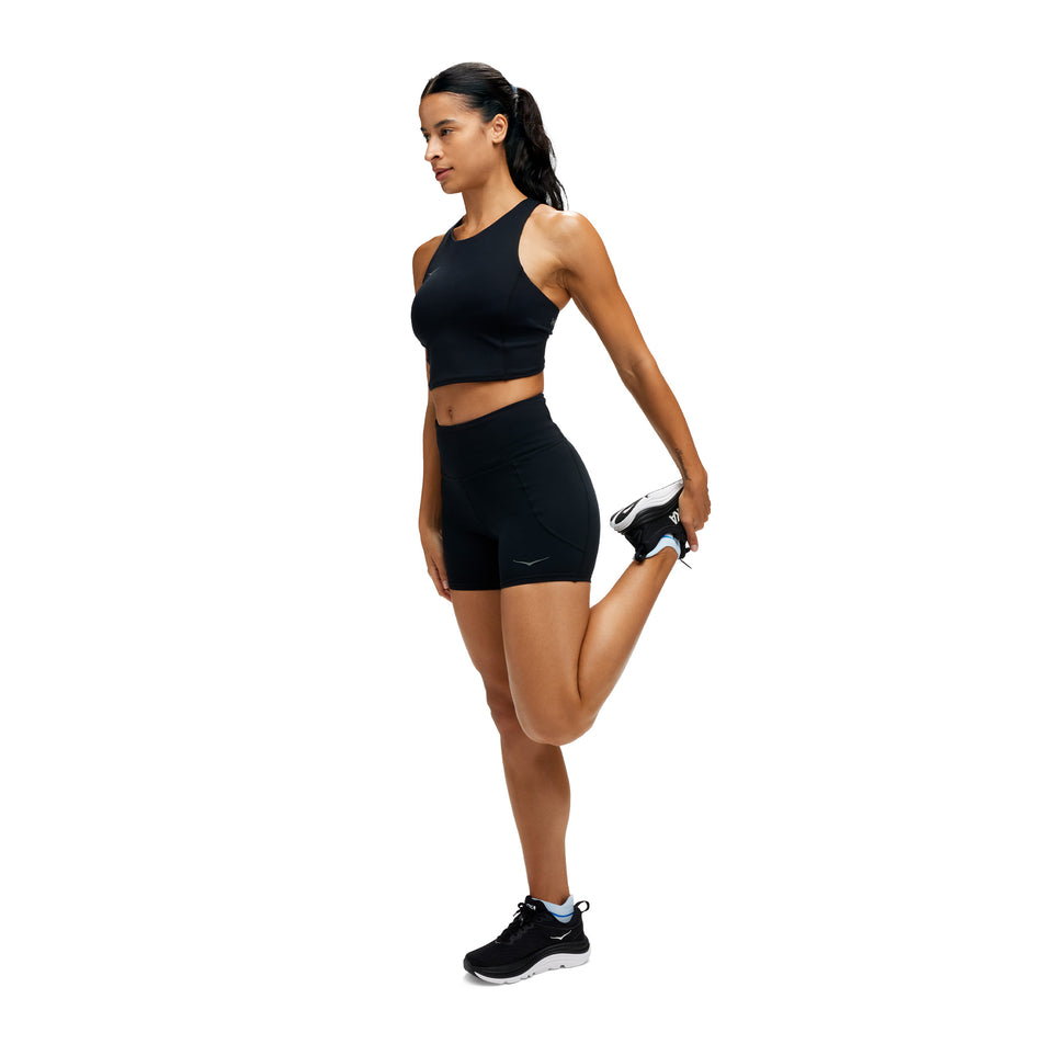 Angled view of a model wearing the HOKA Women's Elaro 5