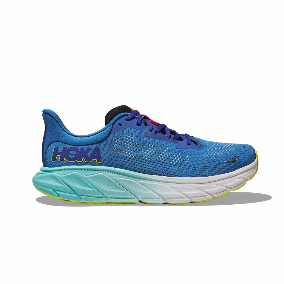 Lateral side of the right shoe from a pair of HOKA Men's Arahi 7 Running Shoes in the Virtual Blue/Cerise colourway (8246538174626)
