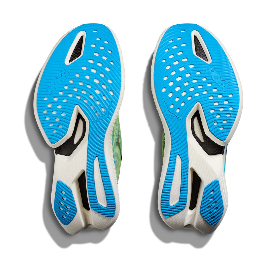 The outsoles on a pair of HOKA Unisex Cielo X1 Running Shoes in the Evening Sky/Lettuce colourway (8164223877282)