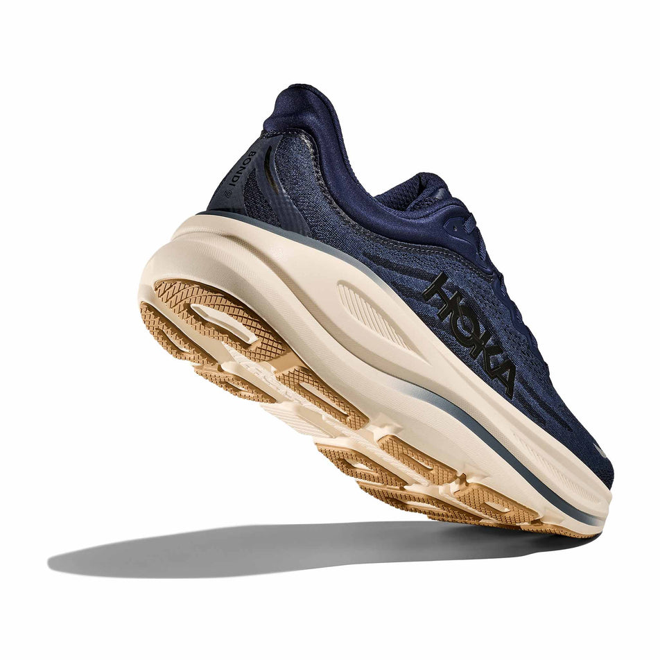 Lateral - and outsole - view of the right shoe from a pair of HOKA Men's Bondi 9 Running Shoes in the Midnight Blue/Varsity Navy colourway.