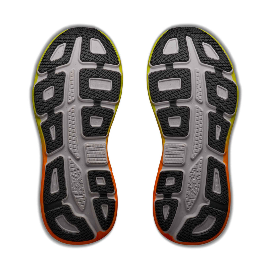 The outsoles of a pair of HOKA Men's Bondi 9 Running Shoes in the White/Neon Tangerine colourway.