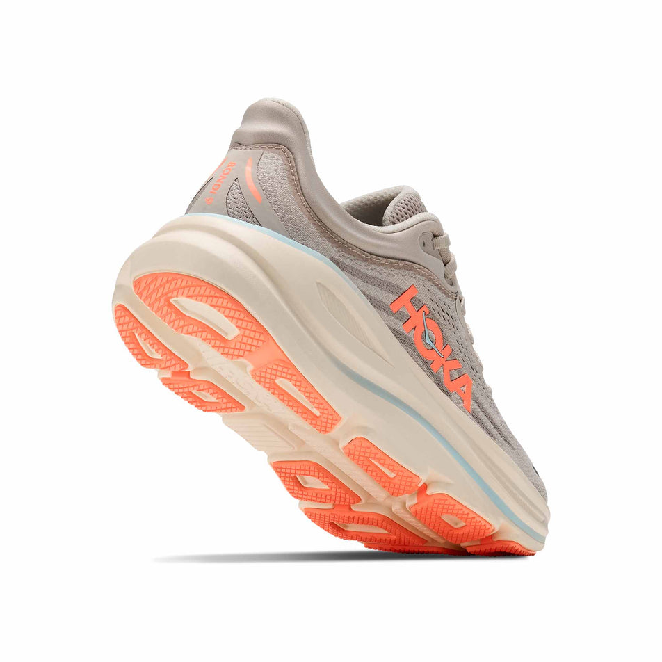 Lateral - and outsole - view of the right shoe from a pair of HOKA Women's Bondi 9 Running Shoes in the River Rock Grey/Mineral Ore colourway.