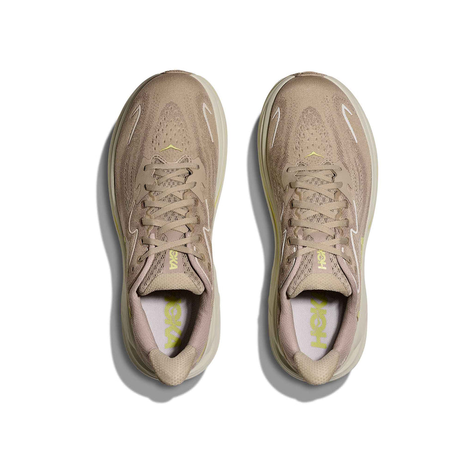 The uppers of a pair of HOKA Men's Clifton 10 Running Shoes in the Raw Linen/Stone colourway. (8689189421218)