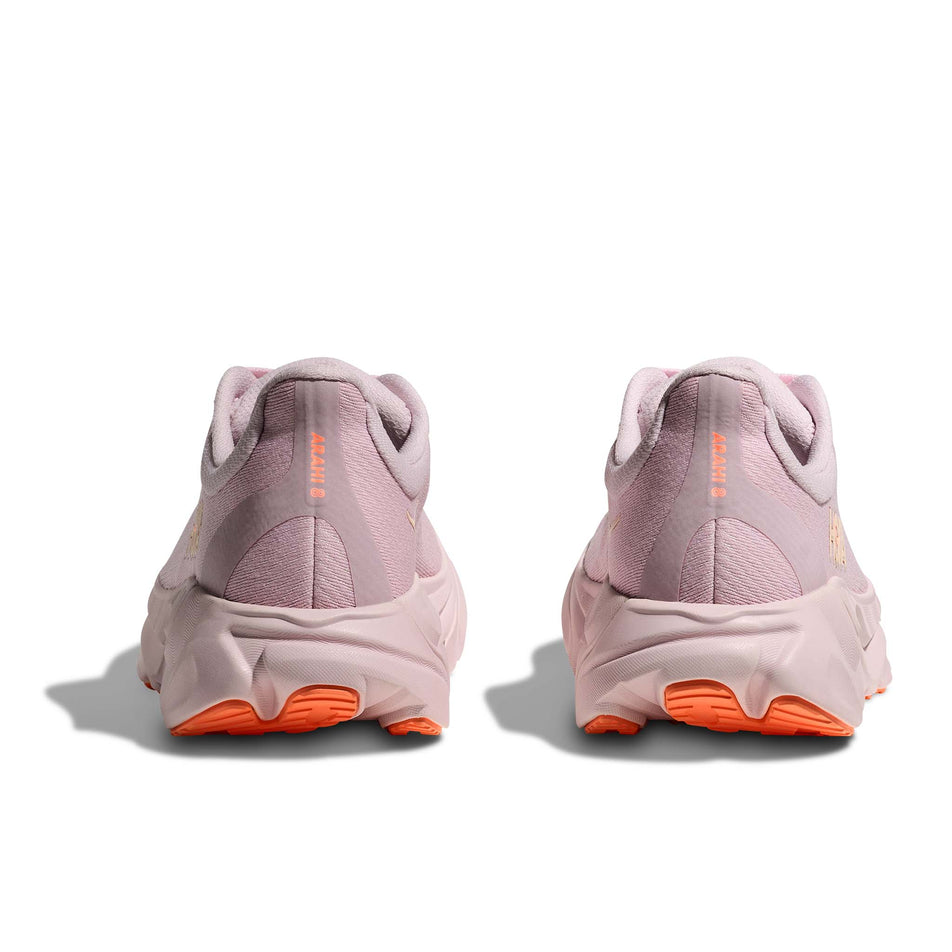 The back of a pair of HOKA Women's Arahi 8 Running Shoes in the Lilac Cream/Neon Cantaloupe colourway.