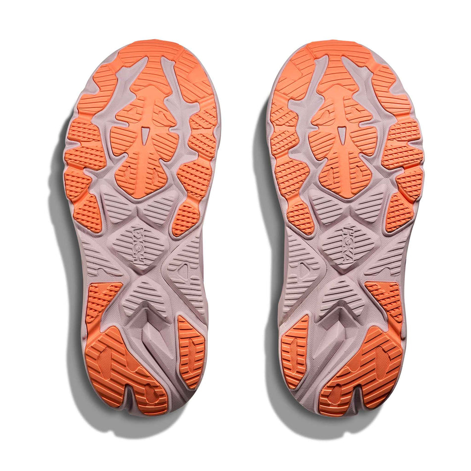 The outsoles of a pair of HOKA Women's Arahi 8 Running Shoes in the Lilac Cream/Neon Cantaloupe colourway.