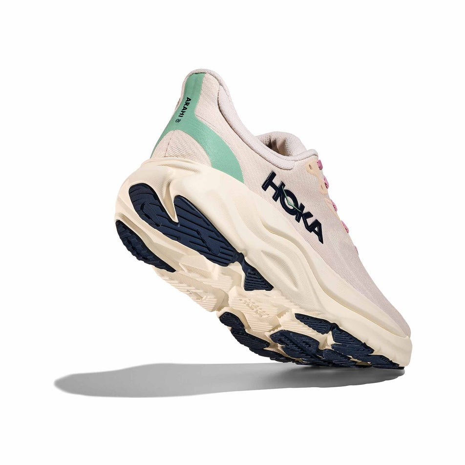 Lateral - and outsole - view of the right shoe from a pair of HOKA Women's Arahi 8 Running Shoes in the Rose Cream/Alabaster colourway. (8689326129314)