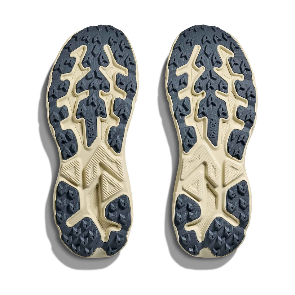 The outsoles of a pair of HOKA Men's Challenger 8 Running Shoes in the Faded Navy/Pampass Grass colourway.