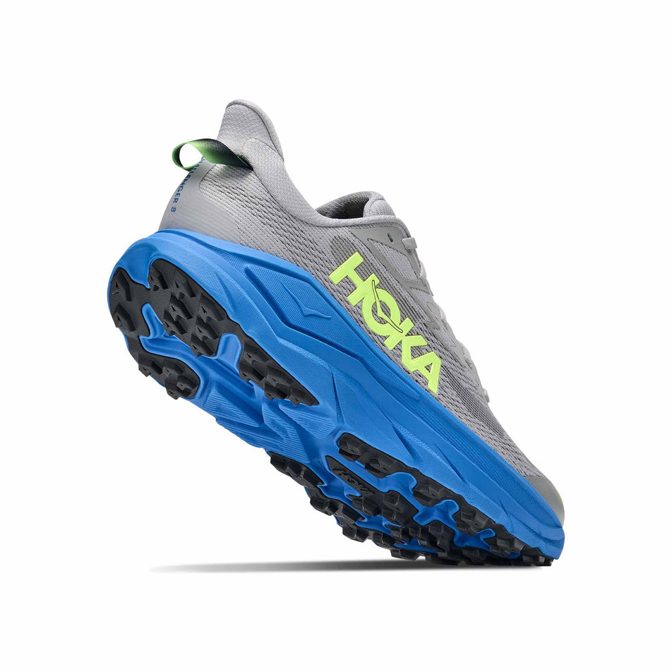 Lateral - and outsole - view of the right shoe from a pair of HOKA Men's Challenger 8 Running Shoes in the Stardust/Virtual Blue colourway.