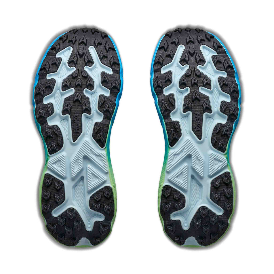 The outsoles of a pair of HOKA Women's Challenger 8 Running Shoes in the Glimmering Blue/Tart Apple colourway.