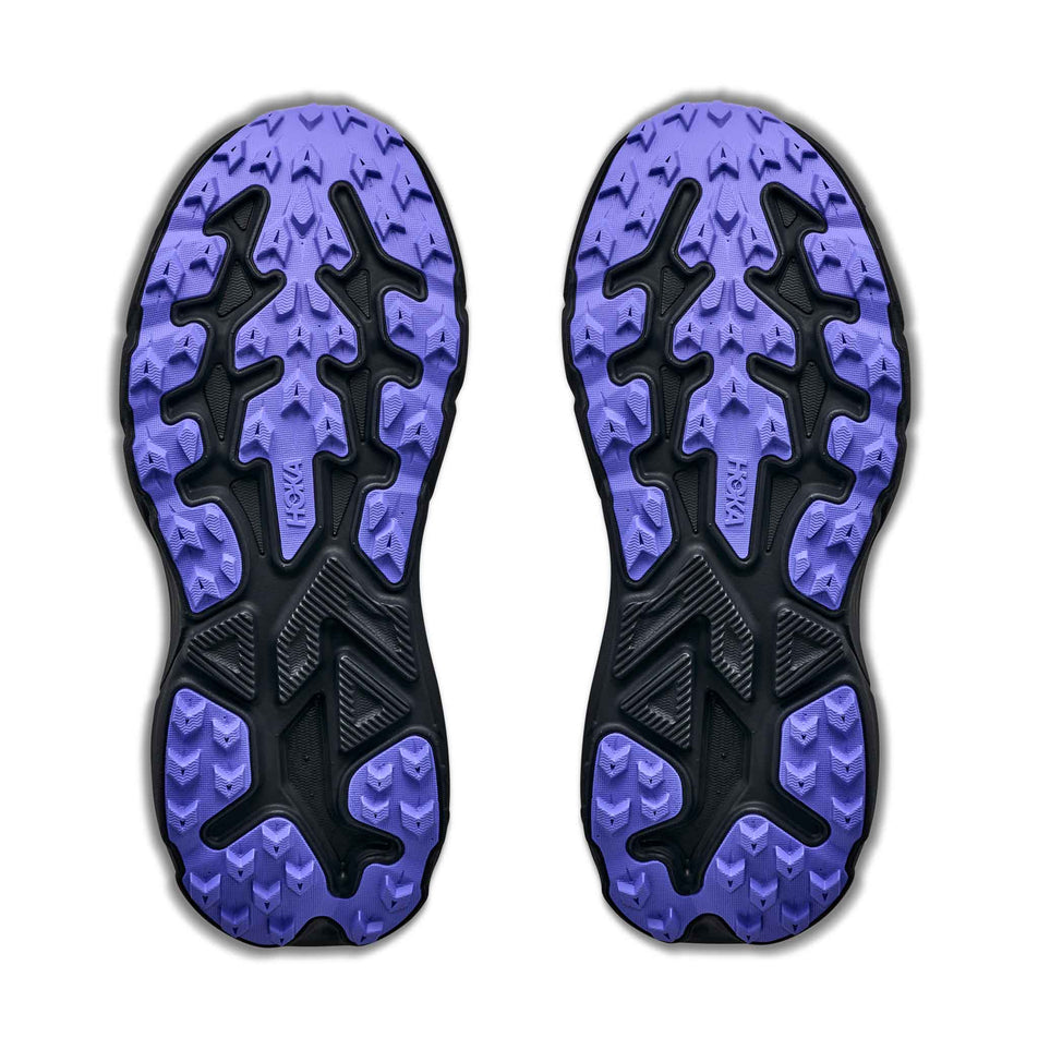The outsoles of a pair of HOKA Women's Challenger 8 Trail Running Shoes in the Purple Fog/Black colourway.