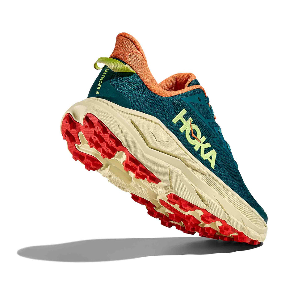 Lateral - and outsole - view of the right shoe from a pair of HOKA Women's Challenger 8 Running Shoes in the Tidal Wave/Pampas Grass colourway.